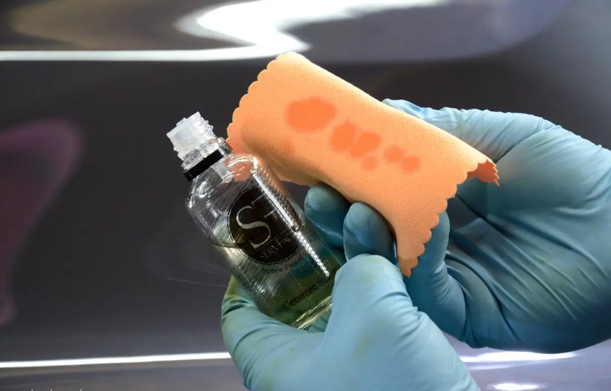 Ceramic coating being loaded onto an applicator