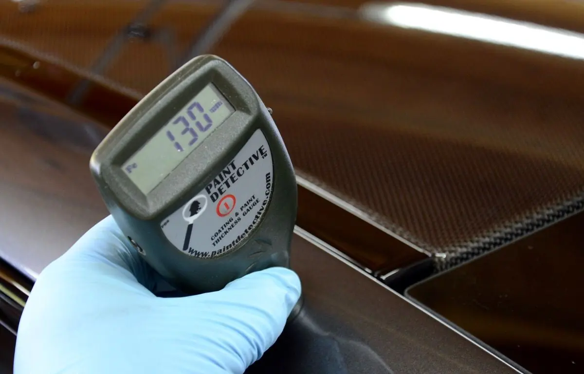 Paint thickness gauge on a BMW M4 GTS panel